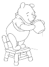 Winnie the Pooh, the bear from the cartoon / book Winnie the Pooh. Here he is on a chair and watch with glittering eyes the honey pot that is.